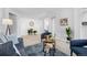 Living room with access to balcony and stylish decor at 7402 S Quail Cir # 1116, Littleton, CO 80127