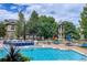 Inviting community pool with lounge chairs at 7402 S Quail Cir # 1116, Littleton, CO 80127