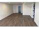 Spacious basement featuring durable wood-look floors and a convenient closet with sliding door at 2000 Irving St, Denver, CO 80211