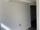 Unfinished basement with white walls, concrete floor, and a doorway leading to another room at 2000 Irving St, Denver, CO 80211