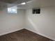 Cozy basement with small windows for natural light and wood flooring at 2000 Irving St, Denver, CO 80211