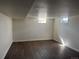Basement featuring laminate flooring, neutral walls, and natural light from window at 2000 Irving St, Denver, CO 80211