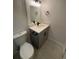Bathroom with modern vanity, toilet, modern fixtures, and tile flooring at 2000 Irving St, Denver, CO 80211