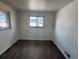 Bedroom featuring wood floors and natural light at 2000 Irving St, Denver, CO 80211