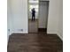 Bright bedroom showcasing a closet and hardwood floors at 2000 Irving St, Denver, CO 80211