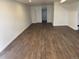 Large bedroom with wood flooring, closet, and freshly painted white walls at 2000 Irving St, Denver, CO 80211
