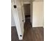 Hallway featuring modern doors and dark wood flooring leading to other rooms at 2000 Irving St, Denver, CO 80211