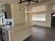 Open-concept kitchen flows into the living area with quartz countertops at 2000 Irving St, Denver, CO 80211