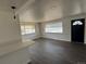 Inviting living room with hardwood floors, bright windows, and a black front door at 2000 Irving St, Denver, CO 80211