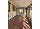 Enclosed sunroom with a tile floor and multiple windows at 2000 Irving St, Denver, CO 80211