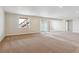 Finished basement area with carpeting, a sliding glass door that gives access to the outside, and recessed lights at 4978 Hickory Oaks St, Castle Rock, CO 80104