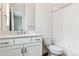 Bright bathroom features a white vanity, a toilet, and a shower-tub combo at 4978 Hickory Oaks St, Castle Rock, CO 80104