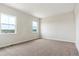 Spacious bedroom with plush carpeting, two bright windows that offer ample natural light and neutral walls at 4978 Hickory Oaks St, Castle Rock, CO 80104