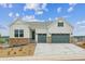 Beautiful two-story home with a brick facade and two-car garage, complemented by a well-manicured lawn at 4978 Hickory Oaks St, Castle Rock, CO 80104