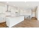 Bright, open kitchen features a large island, modern appliances, and sleek white cabinetry, perfect for entertaining at 4978 Hickory Oaks St, Castle Rock, CO 80104