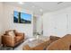 Finished basement with seating area and TV at 3178 Geneva Ct, Denver, CO 80238