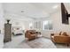 Finished basement includes a seating area, bedroom, and neutral decor at 3178 Geneva Ct, Denver, CO 80238