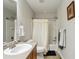 Standard bathroom with a shower and tub combination, and a single sink vanity with tan countertops at 3178 Geneva Ct, Denver, CO 80238