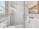 Modern bathroom with glass shower door, subway tile surround, rain shower head, and brushed nickel fixtures at 3178 Geneva Ct, Denver, CO 80238