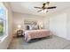 Bedroom featuring plush rug, neutral walls, ceiling fan and closet at 3178 Geneva Ct, Denver, CO 80238