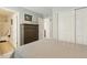 Comfortable bedroom features a neutral palette and a private ensuite bathroom at 3178 Geneva Ct, Denver, CO 80238