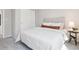 Bedroom featuring patterned headboard, closet and a side table at 3178 Geneva Ct, Denver, CO 80238