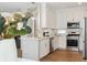 Bright kitchen featuring a stylish island, stainless steel appliances and lots of storage at 3178 Geneva Ct, Denver, CO 80238