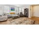 Comfortable living room featuring large windows, stylish furniture, and a warm, inviting atmosphere at 3178 Geneva Ct, Denver, CO 80238