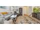 Cozy living room with neutral decor, a plush area rug, and comfortable seating, perfect for relaxation at 3178 Geneva Ct, Denver, CO 80238