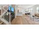 Bright living area with hardwood floors, stylish furnishings, and an open layout to kitchen at 3178 Geneva Ct, Denver, CO 80238