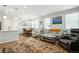Open-concept living space connecting the kitchen and dining area, perfect for modern living and entertaining at 3178 Geneva Ct, Denver, CO 80238