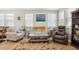 Bright and airy living room featuring stylish furniture, large windows, and an open layout for easy entertaining at 3178 Geneva Ct, Denver, CO 80238