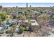A high aerial view of the home showing surrounding neighborhood, trees and skyline at 39 S Grant St, Denver, CO 80209