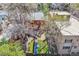 Aerial view of the backyard with stone pathway, red brick building, and blue covering on the grass at 39 S Grant St, Denver, CO 80209