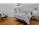 Comfortable bedroom featuring hardwood floors, bright windows, and a cozy seating area at 39 S Grant St, Denver, CO 80209
