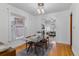 Bright dining room with a glass table, area rug, and view into the living room at 39 S Grant St, Denver, CO 80209
