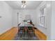 Bright dining room with hardwood floors, modern lighting, and large windows at 39 S Grant St, Denver, CO 80209