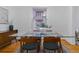 Stylish dining room featuring a glass table, wood chairs, and hardwood flooring at 39 S Grant St, Denver, CO 80209