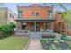 Beautiful two-story brick home with a welcoming front porch and well-maintained landscaping at 39 S Grant St, Denver, CO 80209