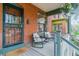 Inviting front porch with chairs, perfect for enjoying quiet moments outdoors at 39 S Grant St, Denver, CO 80209