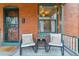 Charming front porch with seating, perfect for relaxing and enjoying the neighborhood views at 39 S Grant St, Denver, CO 80209