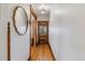 Bright hallway featuring hardwood floors and decorative mirror at 39 S Grant St, Denver, CO 80209