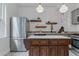 Well-appointed kitchen featuring an island, granite counters, and subway tile backsplash at 39 S Grant St, Denver, CO 80209