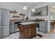 Modern kitchen with stainless steel appliances, butcher block counters and ample cabinet space at 39 S Grant St, Denver, CO 80209