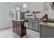 Charming kitchen with gray cabinets, stainless steel appliances, and a functional island at 39 S Grant St, Denver, CO 80209