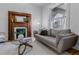 Inviting living room showcasing a decorative fireplace and a comfortable gray couch at 39 S Grant St, Denver, CO 80209
