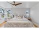 Bright main bedroom with hardwood floors, large windows, and neutral decor at 39 S Grant St, Denver, CO 80209