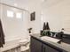 Chic bathroom featuring dark granite vanity and modern fixtures at 17448 E 103Rd Pl, Commerce City, CO 80022