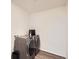 Clean laundry area with new washer and dryer units and modern flooring at 17448 E 103Rd Pl, Commerce City, CO 80022