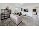 Comfortable living room featuring modern furnishings, neutral decor, and ample natural light at 17448 E 103Rd Pl, Commerce City, CO 80022
